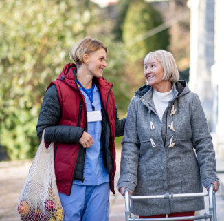 caretaker and elderly woman goes grocery