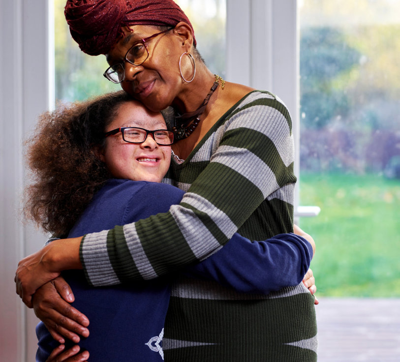 mother and daughter hug each other
